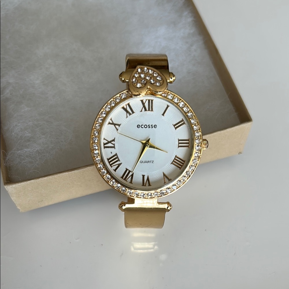 Gold and White Watch with Crystal Bezel and Roman Numerals